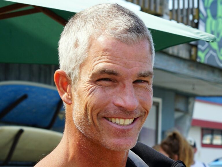 Portrait of man smiling in street