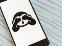Covered eyes emoji on smartphone
