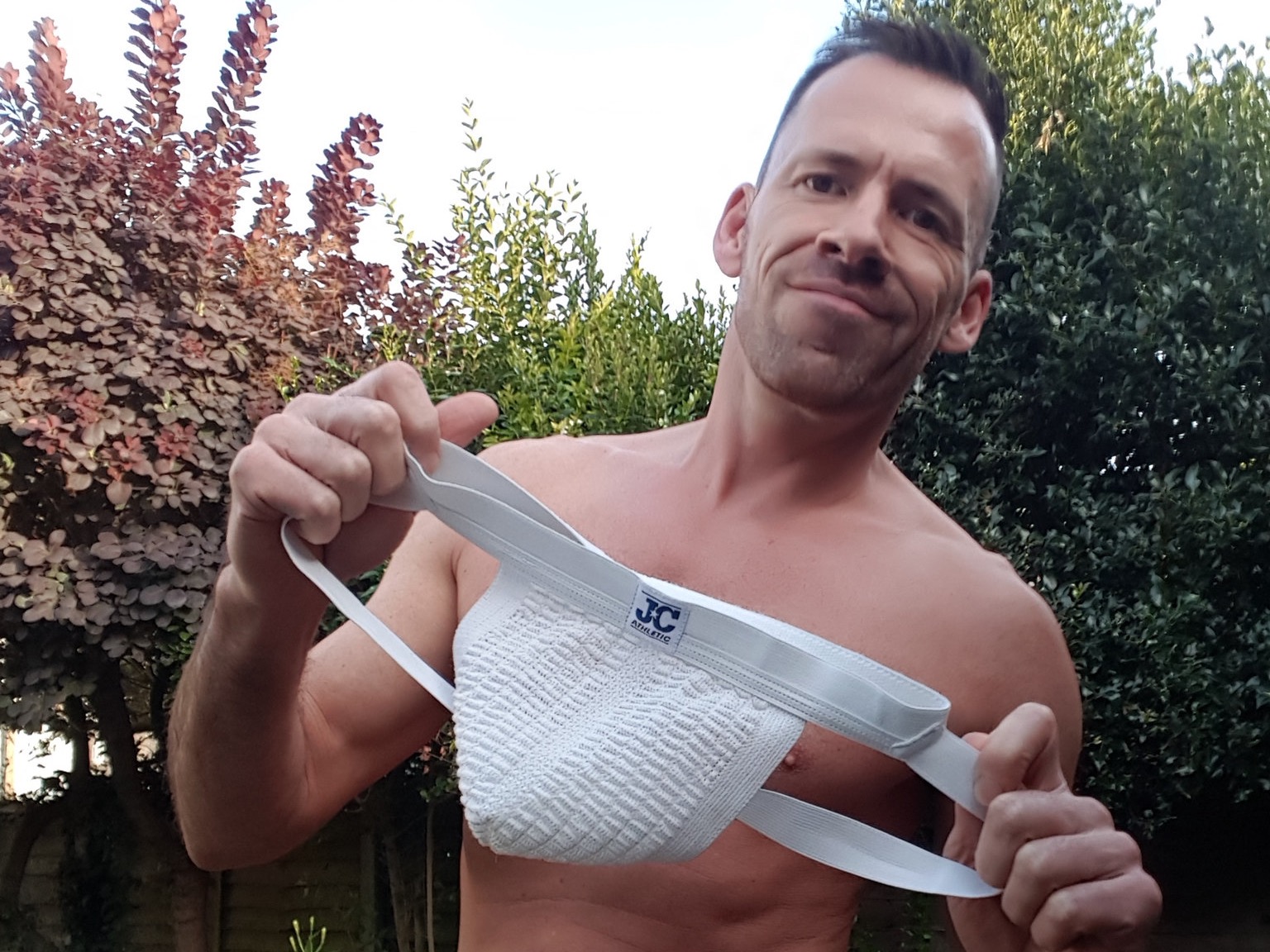 Dave London holding jock