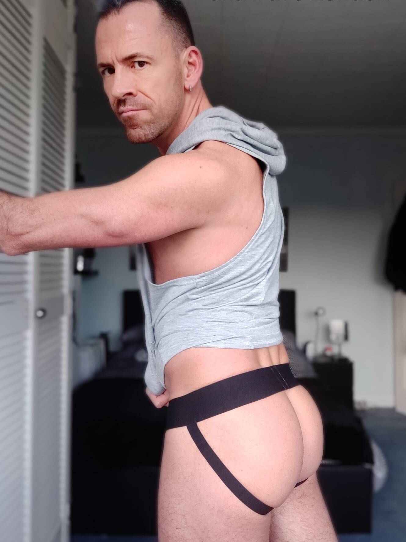 Dave London wearing jockstrap and hoodie