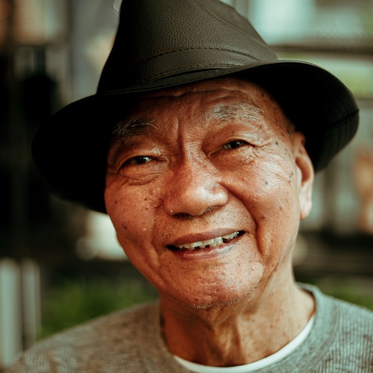 Old man in hat smiling