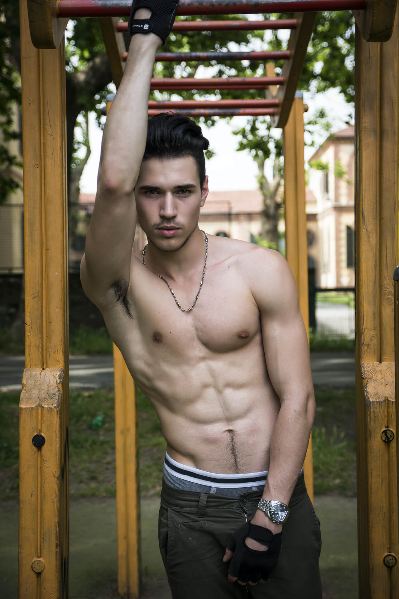 Shirtless man on obstacle course