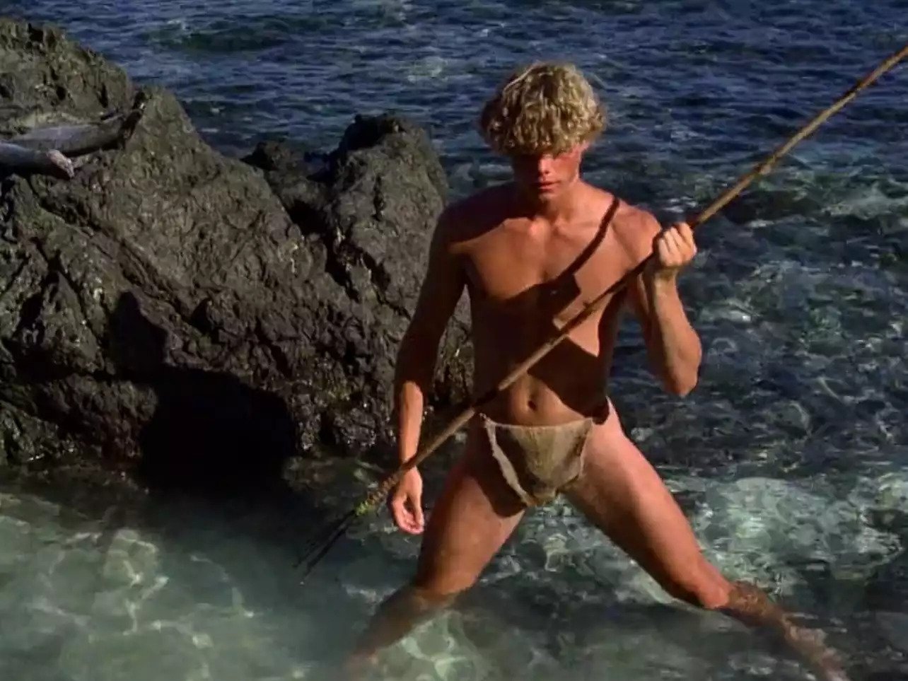Christopher Atkins in loincloth spearfishing