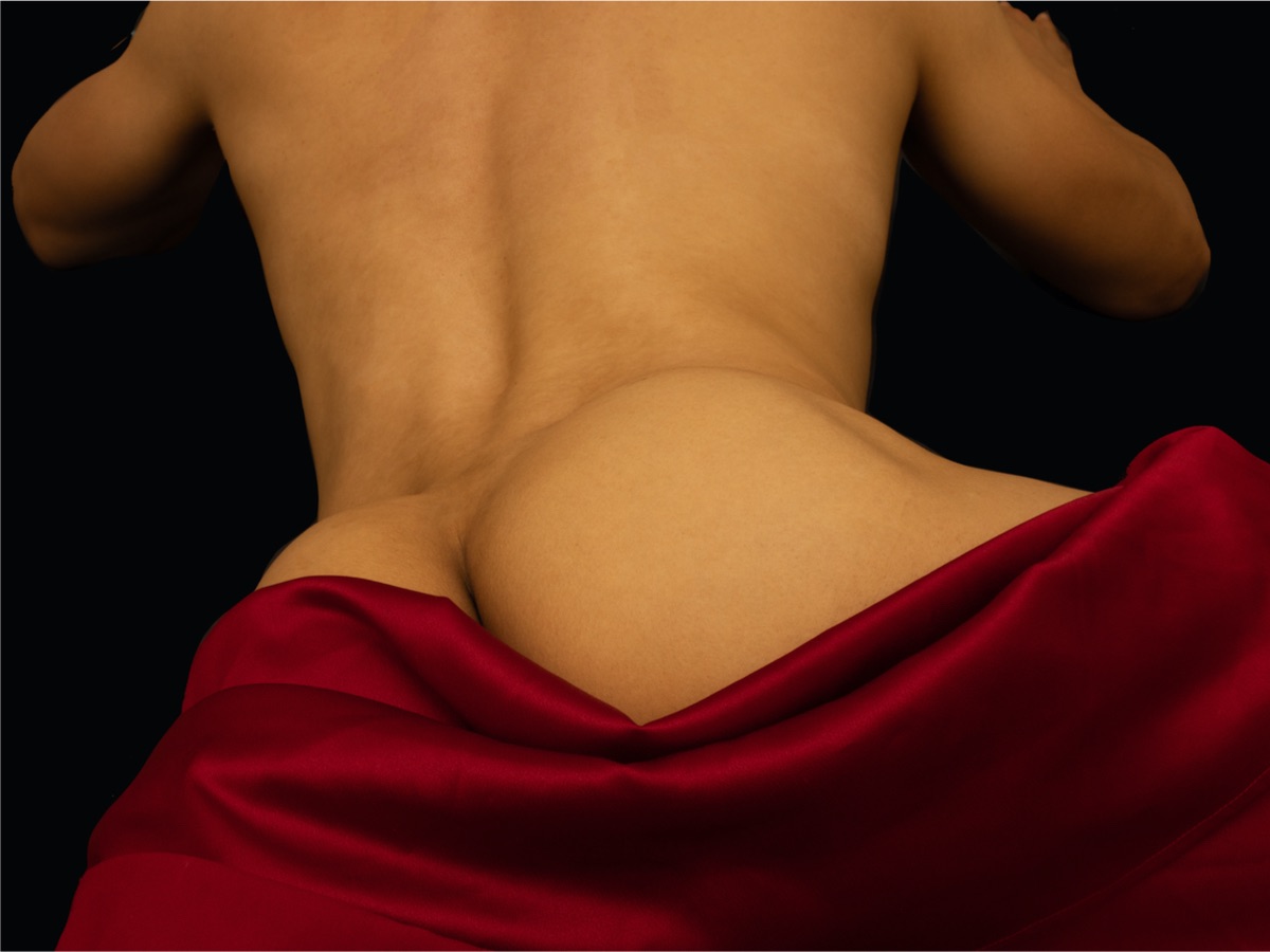 Man lying down with red cover